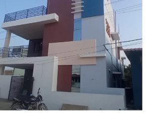 Renovated two-storey house in Andal Nagar, Katpadi with its new three-tone elevation by Gravitas Builders